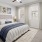a bedroom with a bed and a fan