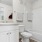 a bathroom with a tub toilet and sink