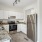 a kitchen with white cabinets