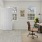 a room with a desk and computer