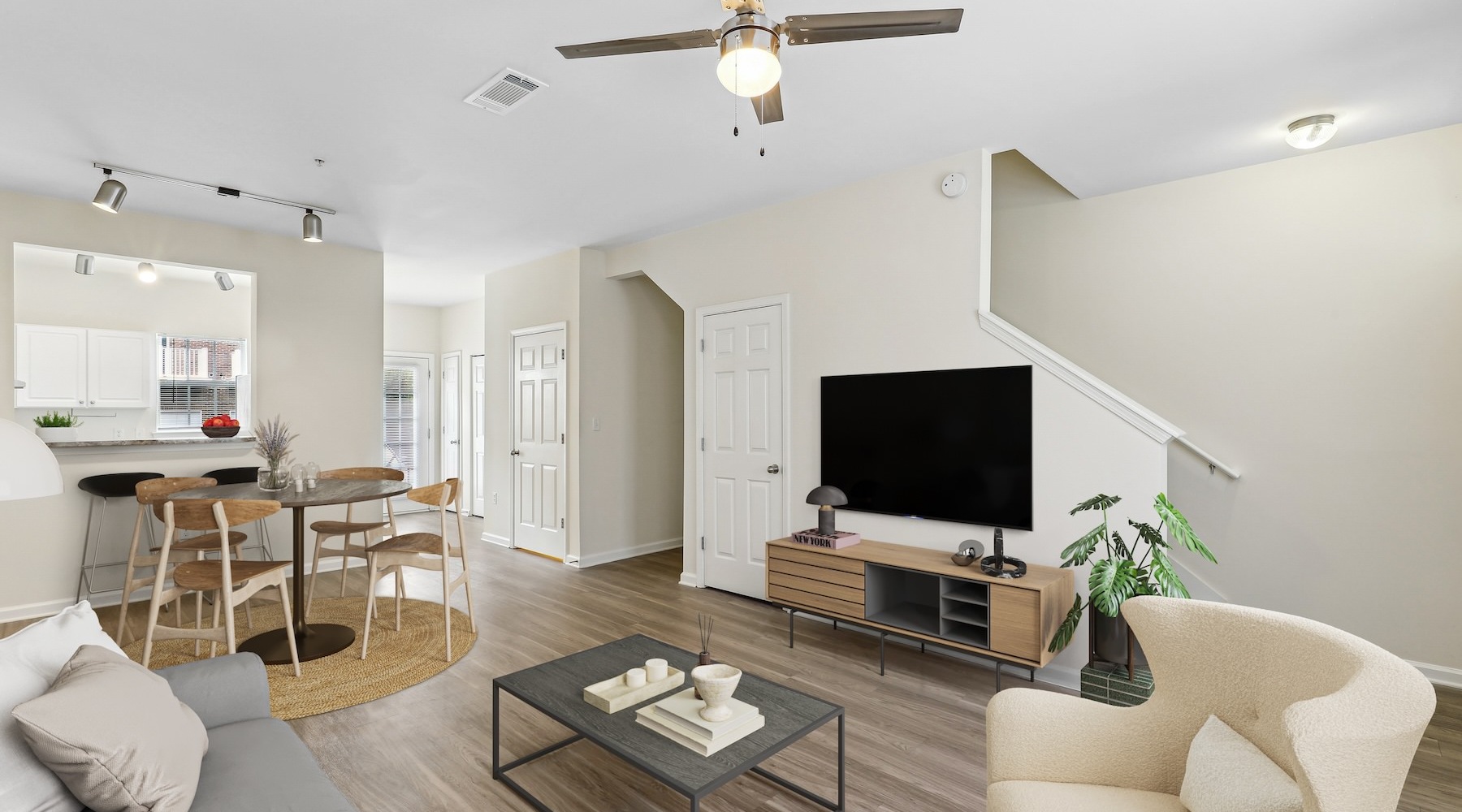 living room with a couch, coffee table, and chairs